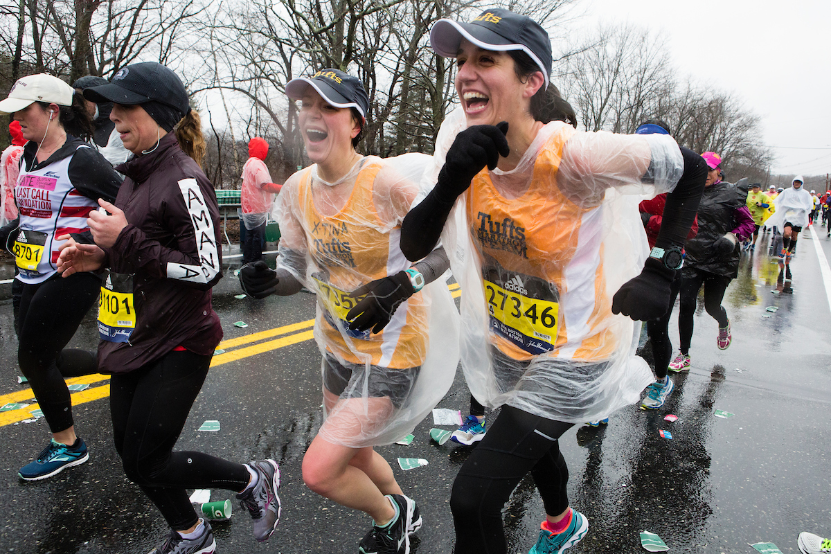 Christina Matulis, M18, left, and Marianna Papageorge, M18, of the Tufts Marathon Team brave the elements. Photo: Anna Miller